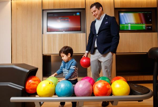 There's a bowling alley in Pearl House, one of many kid-friendly amenities included inside.