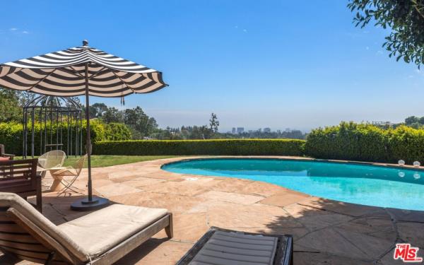 The kidney-shaped pool outside.