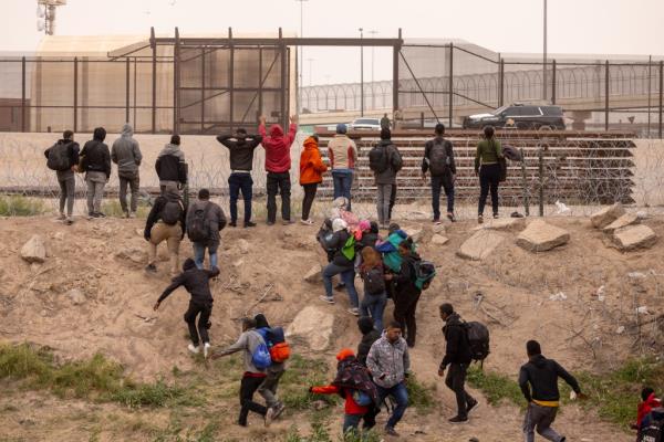 Texas Natio<em></em>nal Guard troops push back migrants who crossed the US-Mexico border illegal on March 24, 2024.