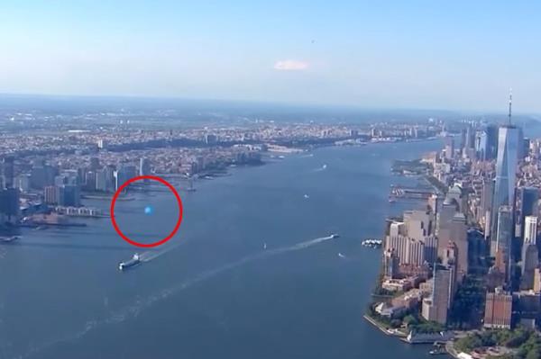 A news helicopter incidentally captured a mysterious orb-like object zooming over the Hudson River and past Lower Manhattan.