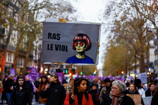 Protestors in a street holding signs